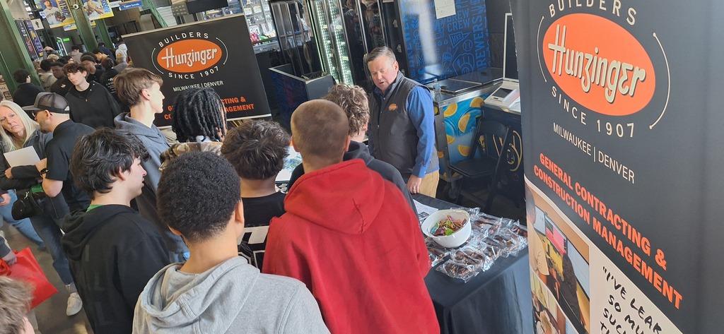 GHS students interested in careers in the trades listen to a industry professional at a career fair.