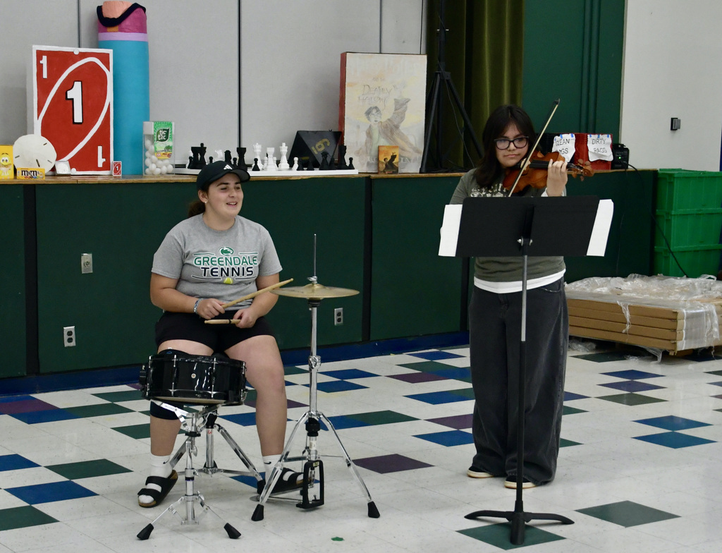 Two students performing a musical piece at Gallery Night.