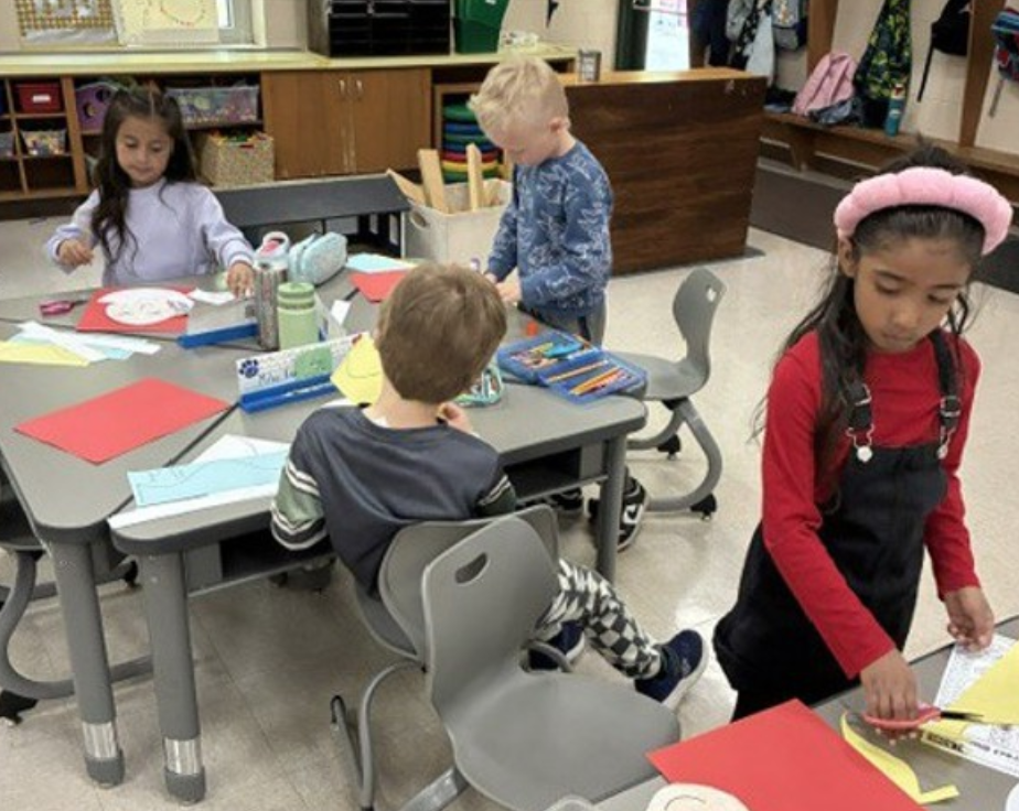 Three 5K students working at their desks.
