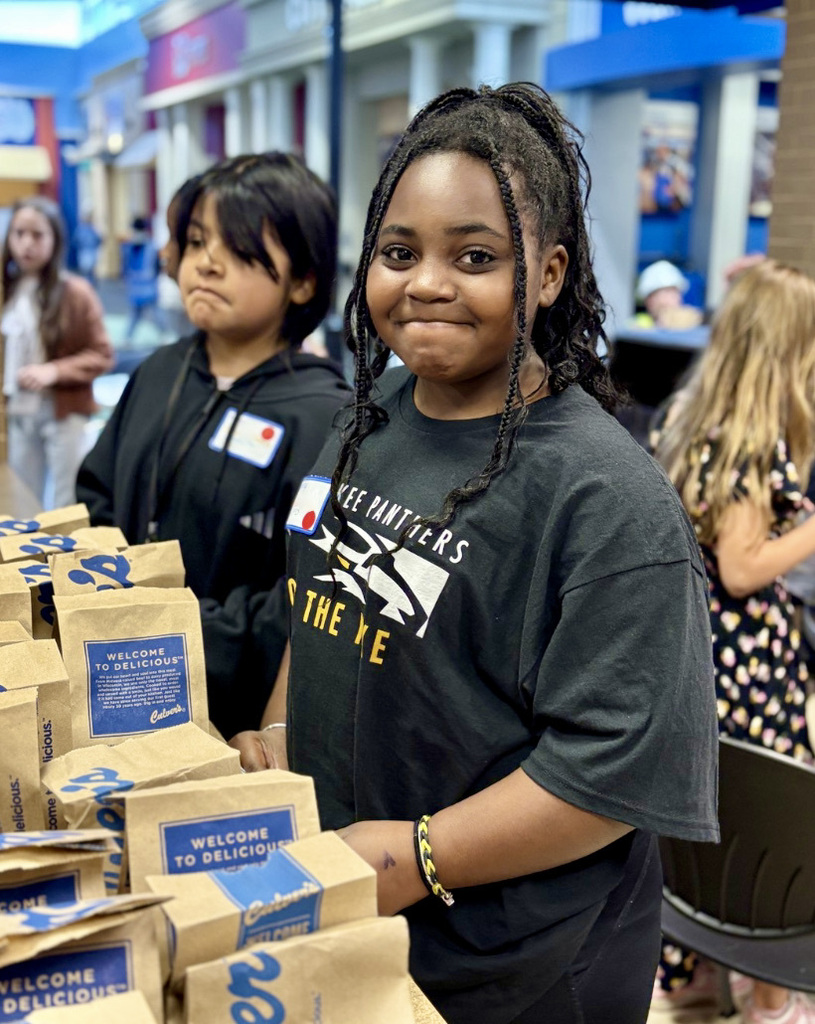 Students working their jobs at Biztown.