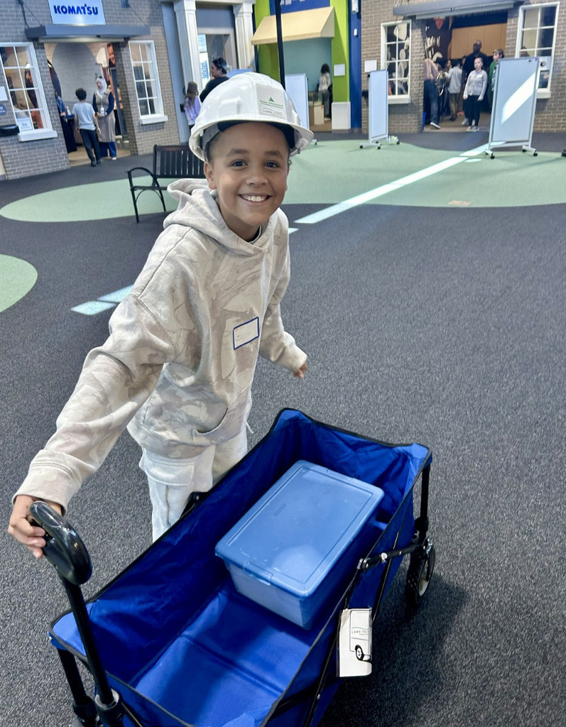A student working a job at Biztown.
