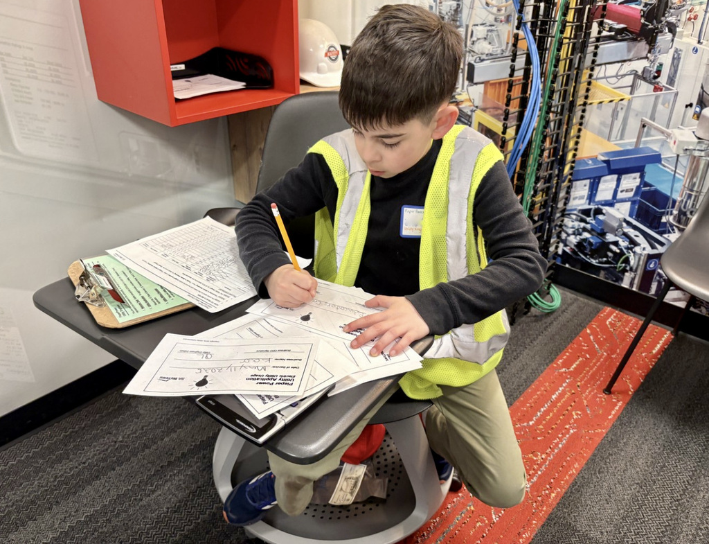 Student working his job at Biztown.