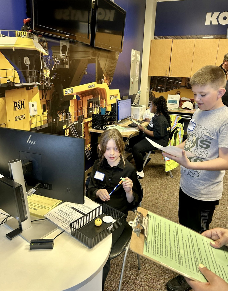 Students working their jobs at Biztown.