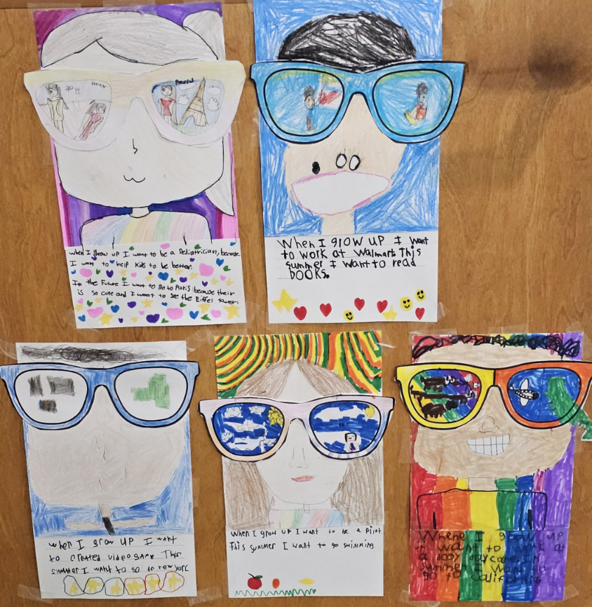 Five pieces of student art from multilingual learners that show faces with sunglasses and writing about their dreams and goals.