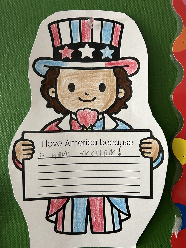 Student art that says "I love America because I have freedom."