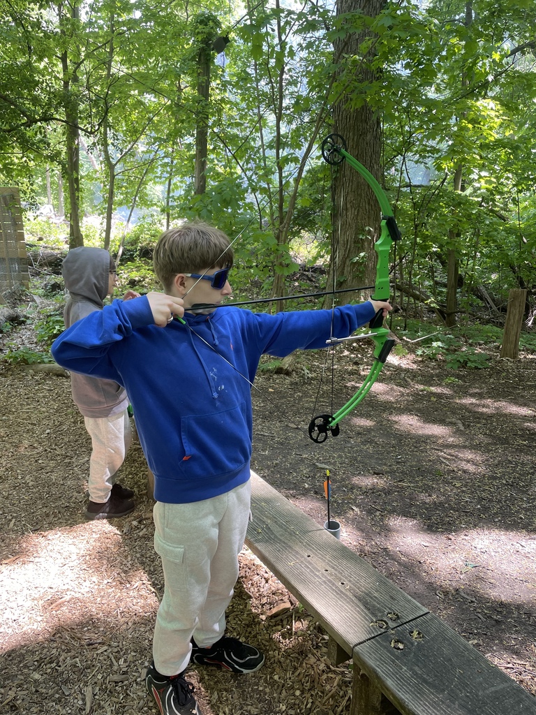 Student trying archery at Outdoor Ed.