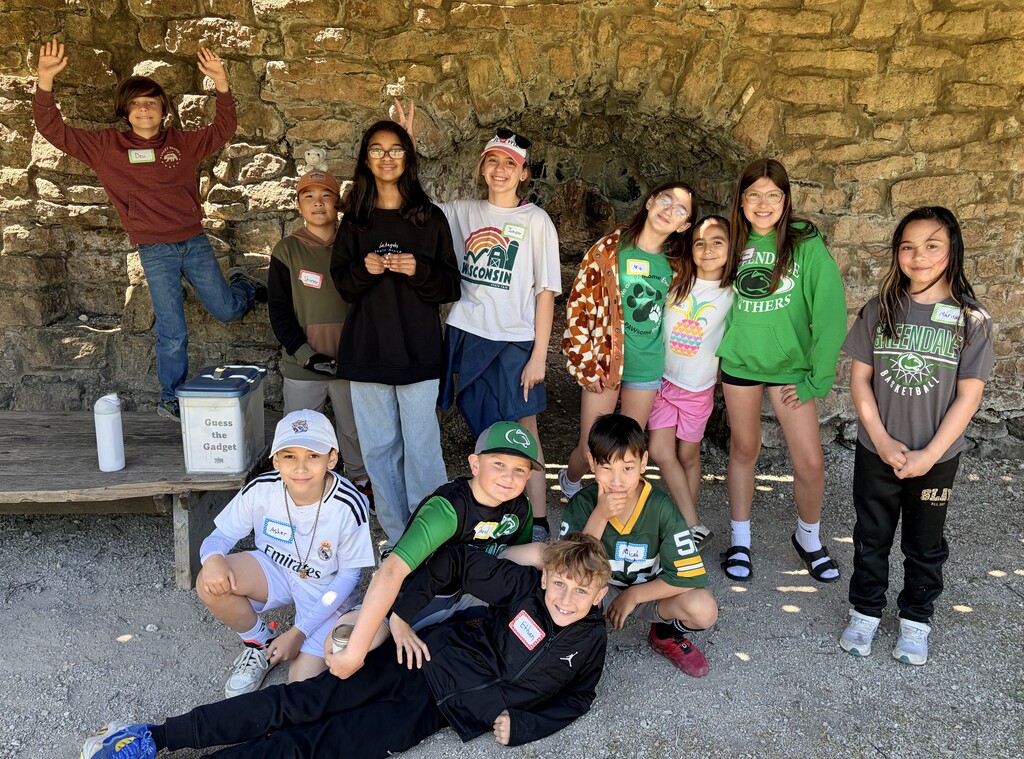 Students smiling and posting together at the Trimborn Farm field trip.