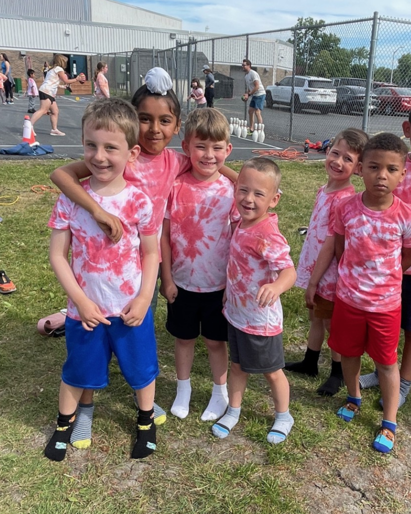 Students posing and smiling at Olympic Day at College Park.
