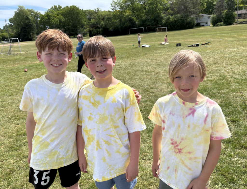 Students posing and smiling at Olympic Day at College Park.