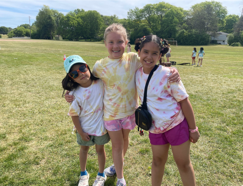 Students posing and smiling at Olympic Day at College Park.