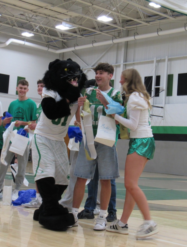 Panther mascot and homecoming King and Queen