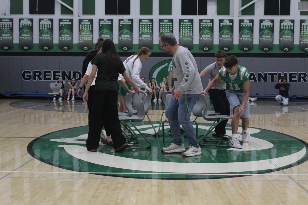 A game of musical chairs with students and teachers playing