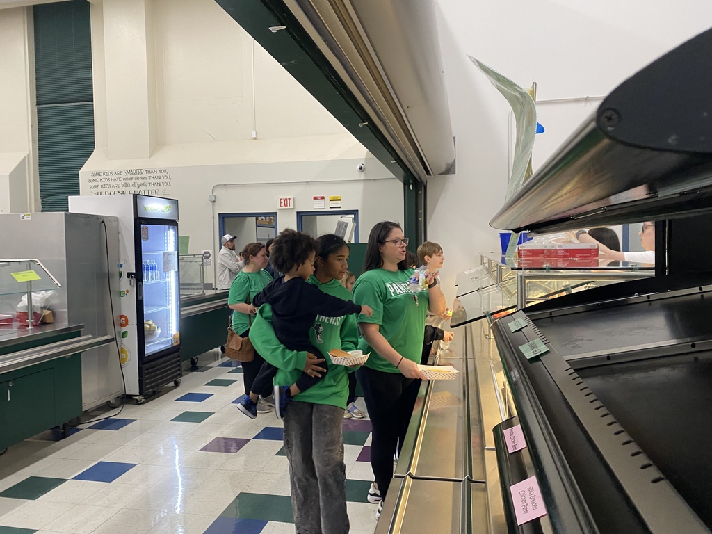 People standing in the lunch line getting a meal