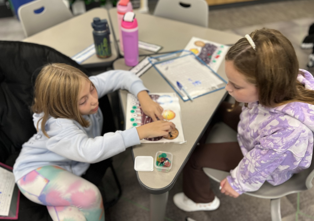Two third graders play a fun, new game to learn subtraction facts.