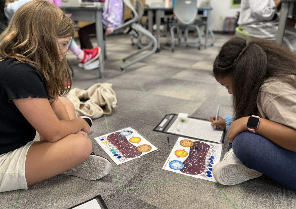 Two third graders play a fun, new game to learn subtraction facts.