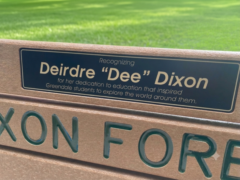 Bench in Dixon Forest with a plaque that says Recognizing Deidre "Dee" Dixon