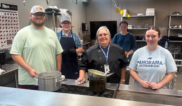 Chef D with her students making egg Benedict with hollandaise sauce! 