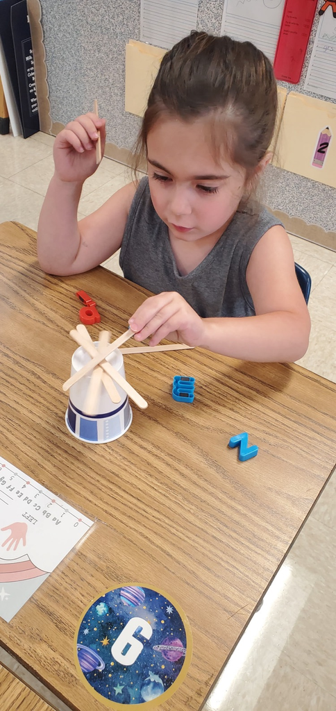 Mrs. Melissa's class having some fun with our ABC Bootcamp today: Chicka Chicka Boom Boom! We built our own letter coconut trees!