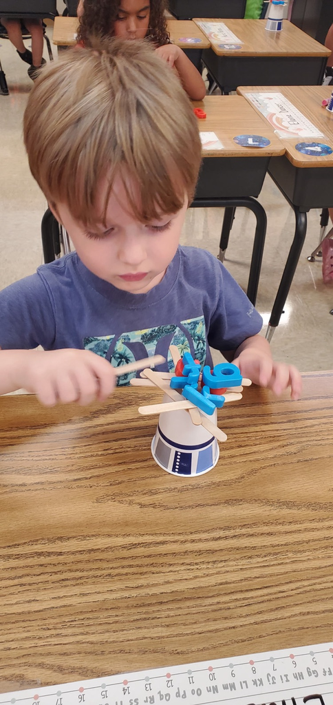 Mrs. Melissa's class having some fun with our ABC Bootcamp today: Chicka Chicka Boom Boom! We built our own letter coconut trees!