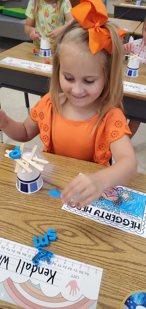 Mrs. Melissa's class having some fun with our ABC Bootcamp today: Chicka Chicka Boom Boom! We built our own letter coconut trees!
