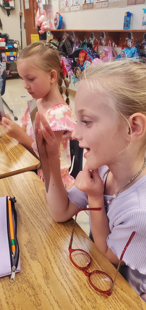 Mrs. Melissa's class is the beginning writing phase which includes learning to draw. Today we looked at our facial features and drew self portraits!