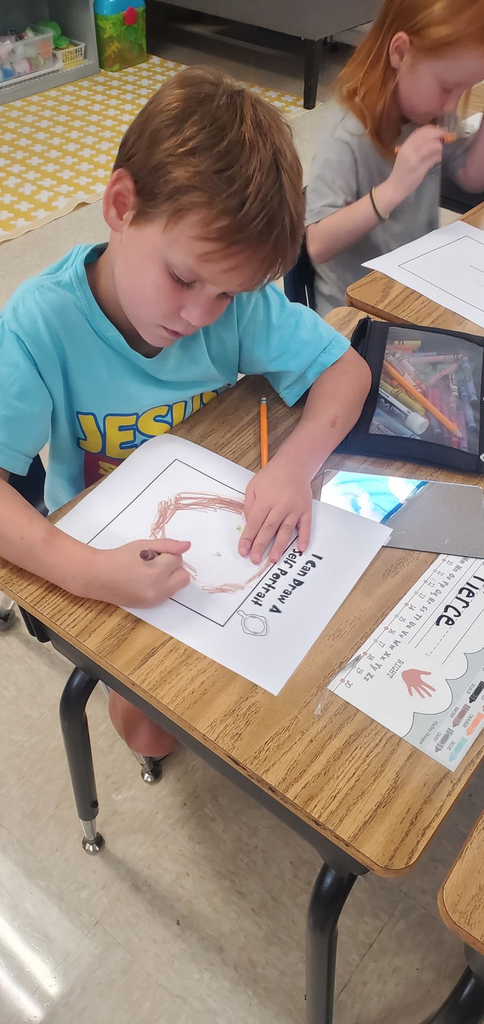 Mrs. Melissa's class is the beginning writing phase which includes learning to draw. Today we looked at our facial features and drew self portraits!