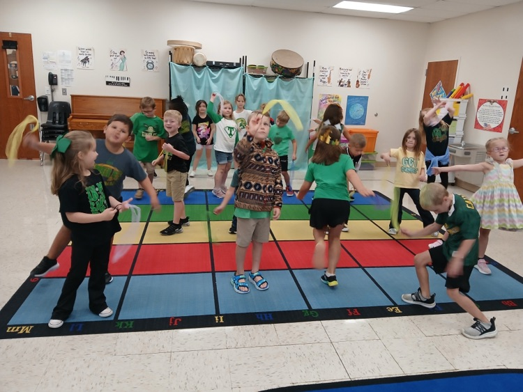 Mrs. McMillons class creating movement to music with scarves.