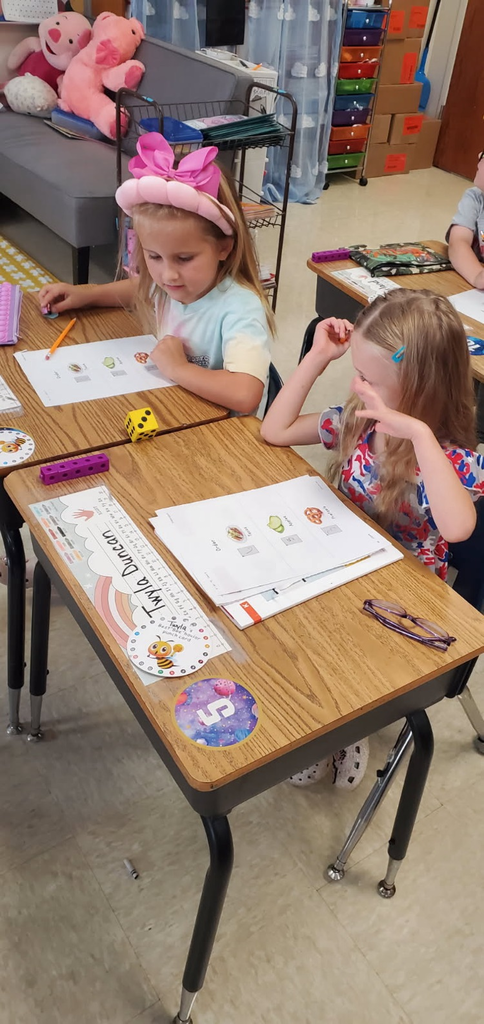 Mrs. Melissa's class having fun with learning. In math, we worked on subitizing and writing numbers by taking each other's order for tacos, apples, and pretzels.