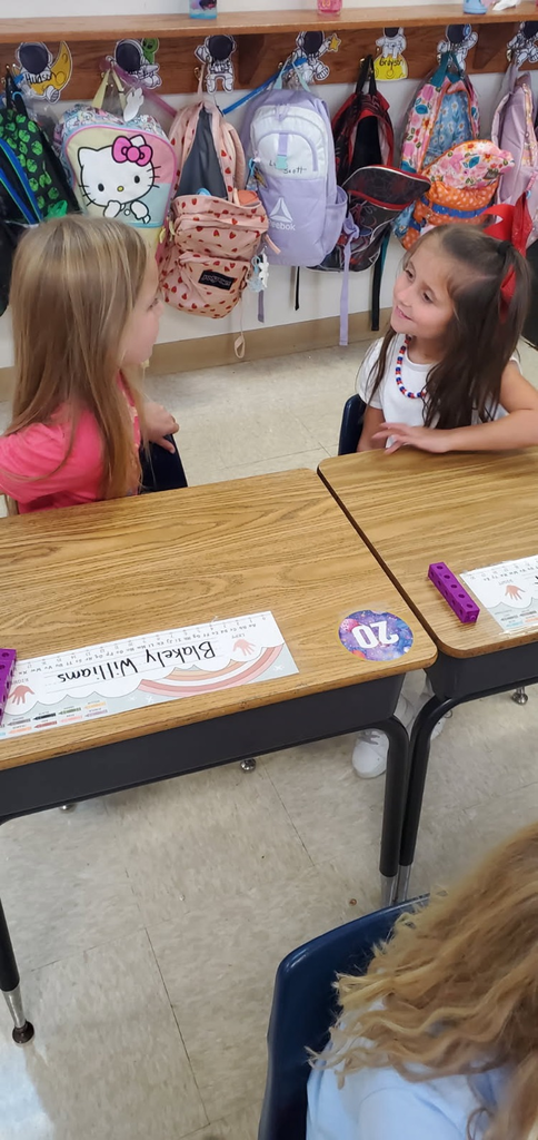 Mrs. Melissa's class having fun with learning. In math, we worked on subitizing and writing numbers by taking each other's order for tacos, apples, and pretzels.
