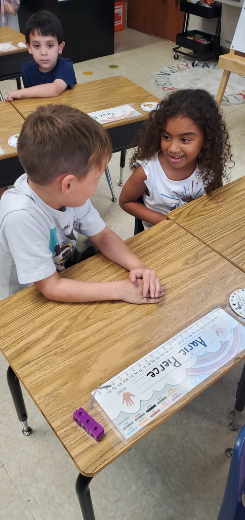 Mrs. Melissa's class having fun with learning. In math, we worked on subitizing and writing numbers by taking each other's order for tacos, apples, and pretzels.