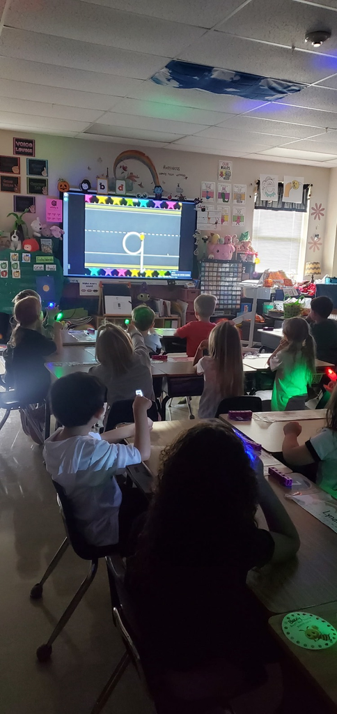Mrs. Melissa's class taking a moment to work on path of movement with laser finger lights!
