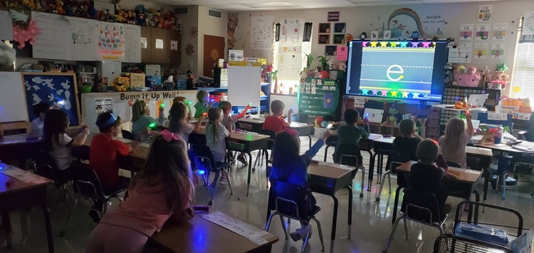 Mrs. Melissa's class taking a moment to work on path of movement with laser finger lights!