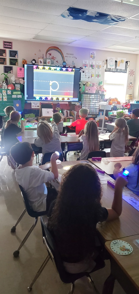 Mrs. Melissa's class taking a moment to work on path of movement with laser finger lights!
