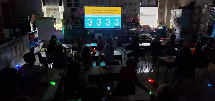 Mrs. Melissa's class taking a moment to work on path of movement with laser finger lights!