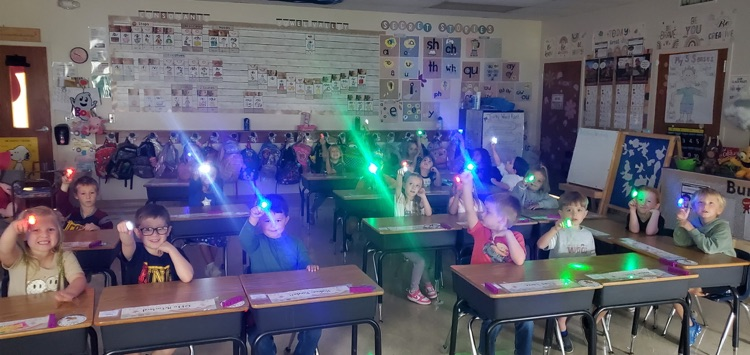 Mrs. Melissa's class taking a moment to work on path of movement with laser finger lights!