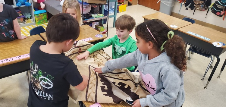 Mrs. Miller's class is working their way through the Knowledge Unit about Native Americans.  We got to see and touch some of the items Native Americans would have made, used, and wore.