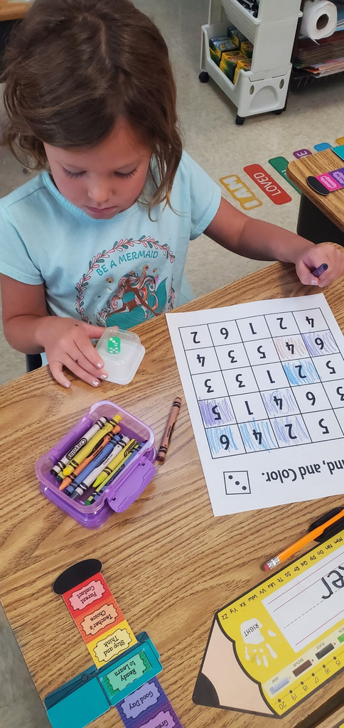 Mrs Melissa's class is making Math Fun ..Subitizing with Dice: Roll and Cover, and counting objects in a group with making Shape People!