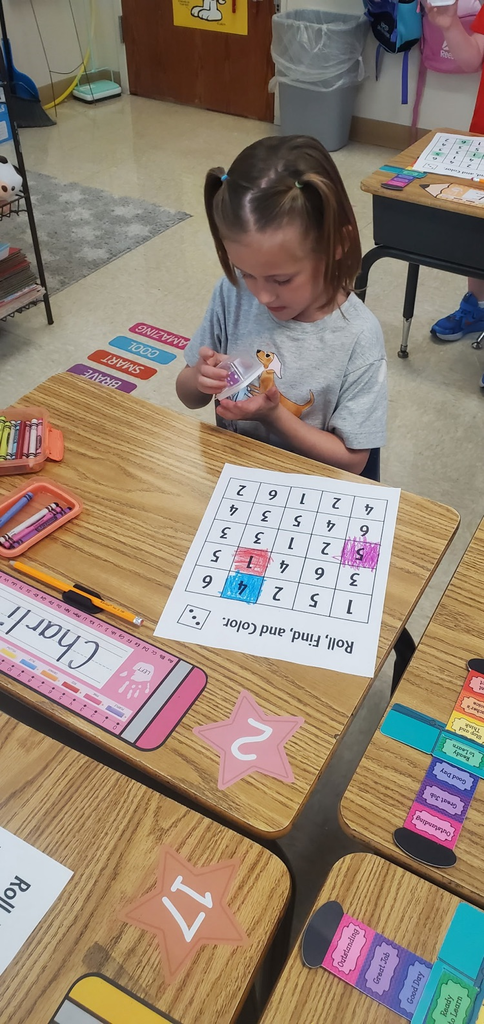 Mrs Melissa's class is making Math Fun ..Subitizing with Dice: Roll and Cover, and counting objects in a group with making Shape People!