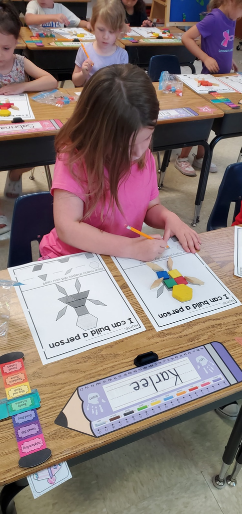 Mrs Melissa's class is making Math Fun ..Subitizing with Dice: Roll and Cover, and counting objects in a group with making Shape People!