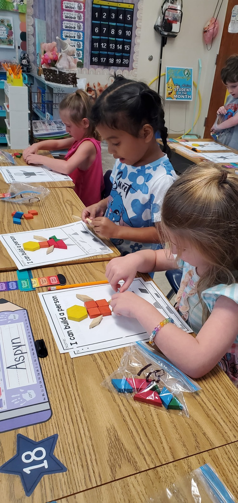 Mrs Melissa's class is making Math Fun ..Subitizing with Dice: Roll and Cover, and counting objects in a group with making Shape People!