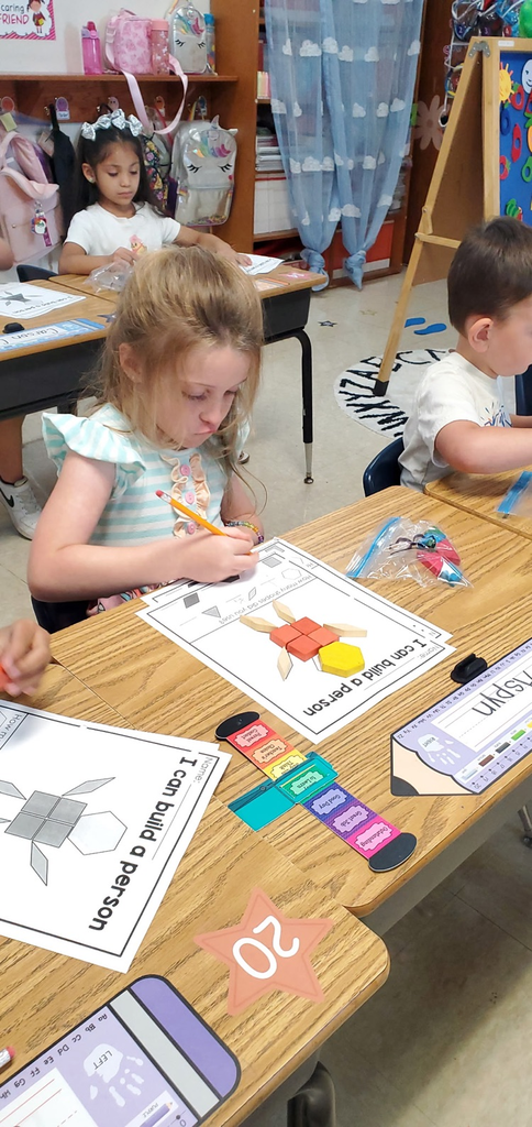 Mrs Melissa's class is making Math Fun ..Subitizing with Dice: Roll and Cover, and counting objects in a group with making Shape People!