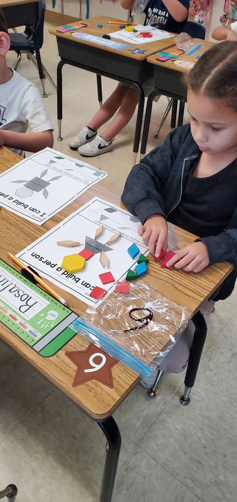 Mrs Melissa's class is making Math Fun ..Subitizing with Dice: Roll and Cover, and counting objects in a group with making Shape People!