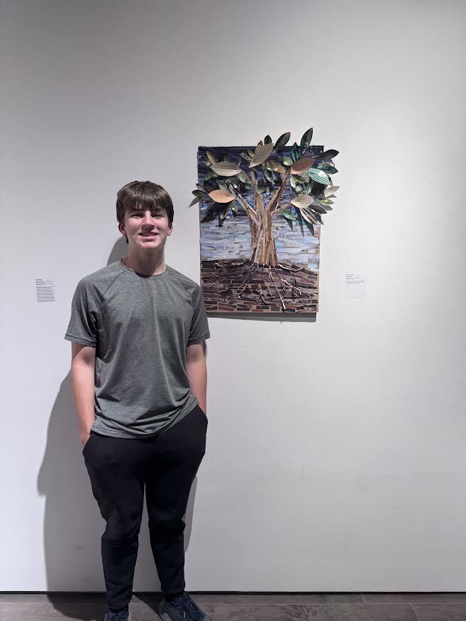 Art student with his work