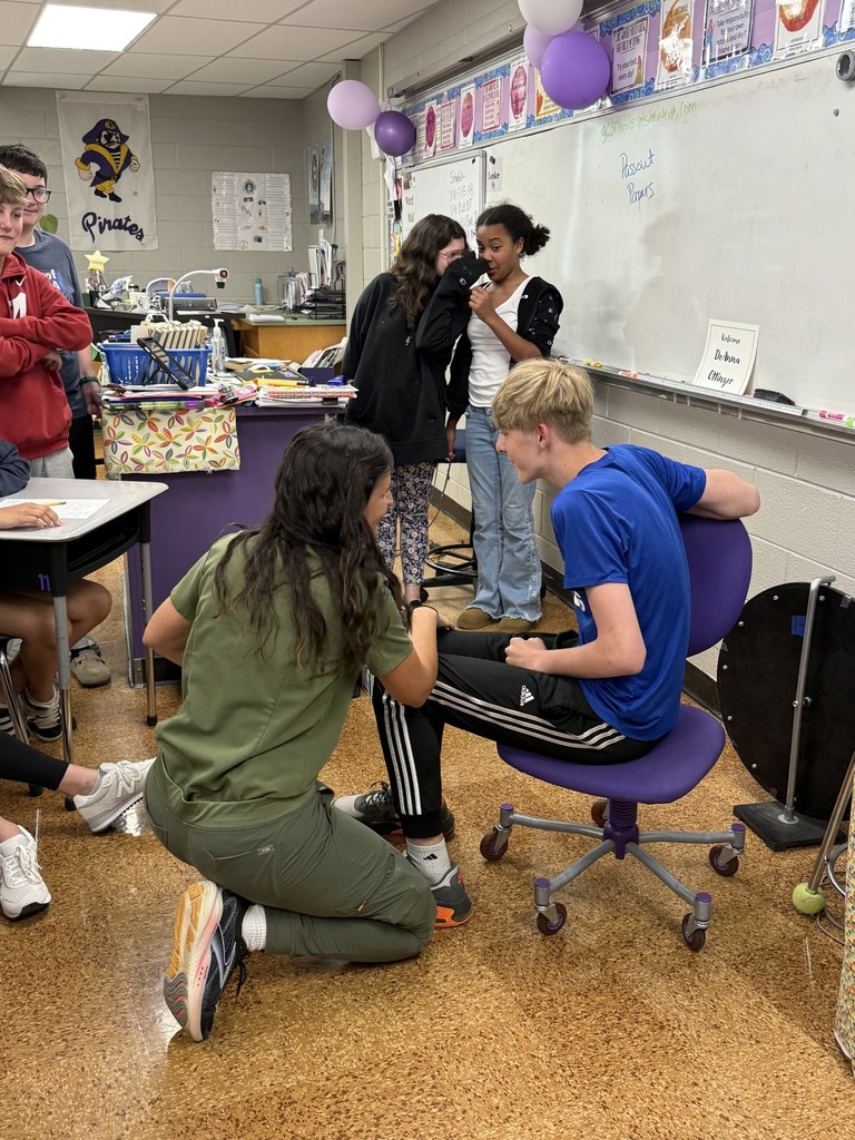 Students gathered in a classroom participating in a hands-on career day activity.