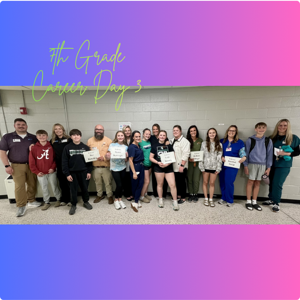 Group of students and adults standing in a school hallway during “7th Grade Career Day,” with several people holding signs representing different careers and a colorful gradient banner with the event title above.