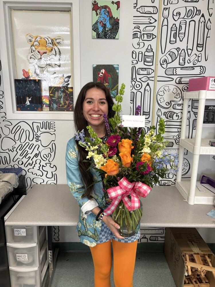 Ms Martinez with her flowers from the district