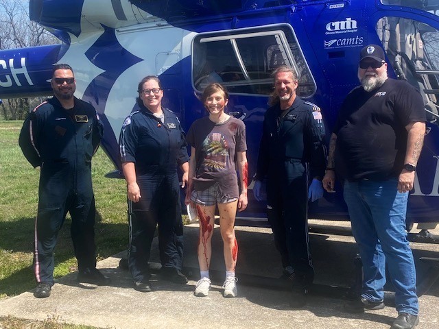 Photo showing student posing with Cox Flight Crew