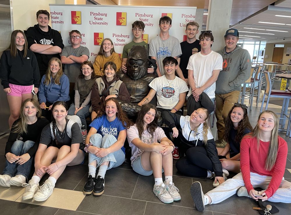 Image of students with statue of Pitt State Gorilla mascot. Students are as follows: Front (L to R):Chloe Mays, Anna Esposito, Briar Wallen, Hannah Hughes, Addisyn Myers, Chloe Jones, Drew Miller Middle (L to R): Izzy DeJager, Cailey Boyd, Chloe Purkey, Hattie Hayes, Owen Daniel, Andrew Mays Back (L to R): Donnie Pierce, Christian Land, Alex Tankesley, Caleb Strieter, Seth Bullinger, Jaxan Marshall, Anias Pedigo