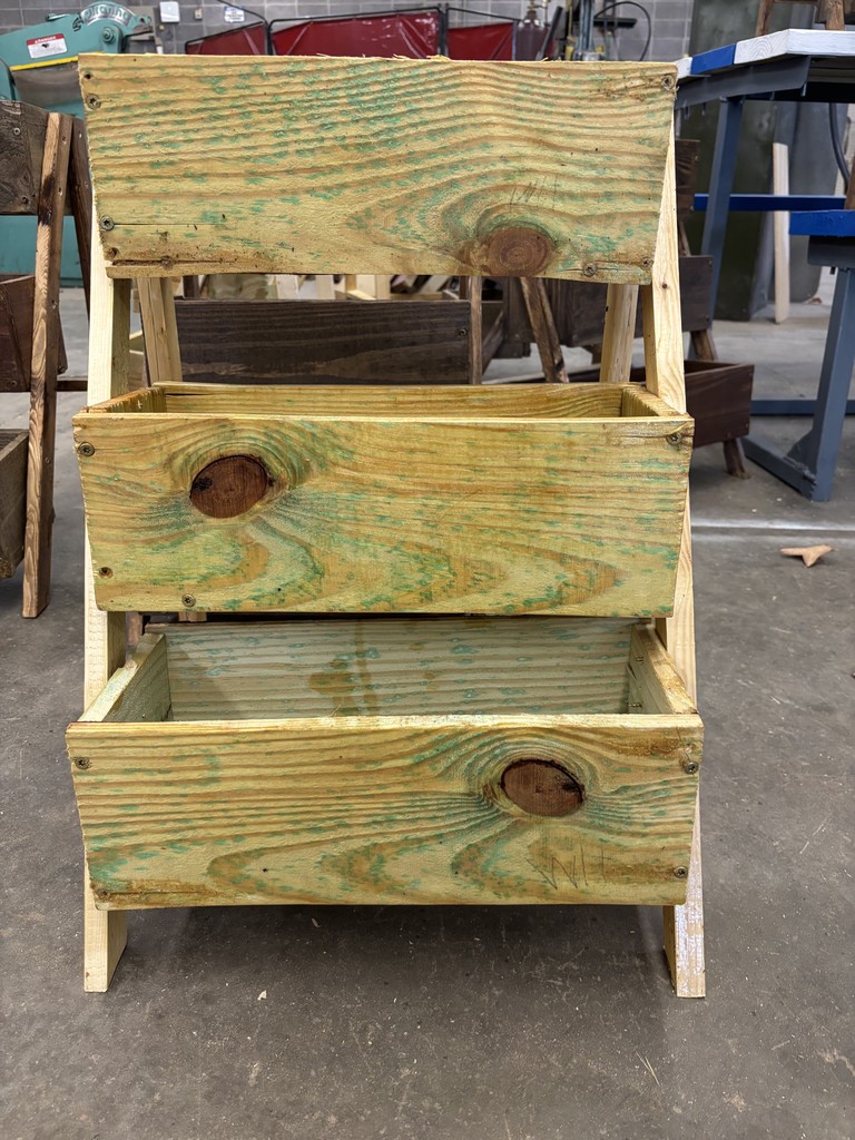 Front view of a three-tiered planter box in light wood