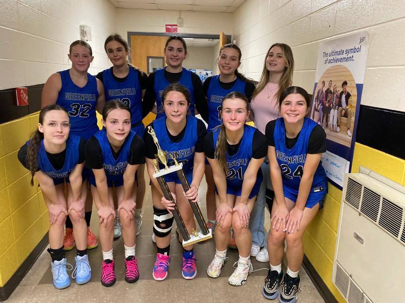 Image of Greenfield Lady Wildcats team holding their tournament trophy